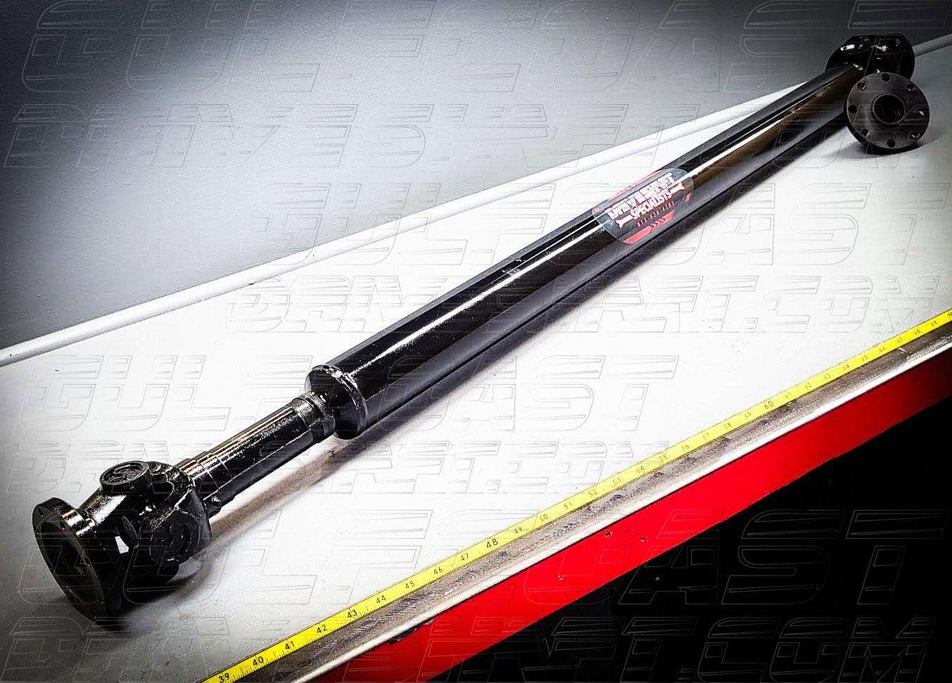 Black Jeep Gladiator 1350 Series CV driveshaft combo featuring solid U-joints and flanges, designed for optimal durability.