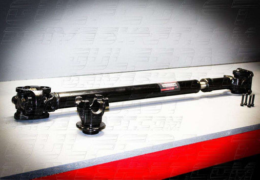 Front and rear 1310 series driveshaft for 2018+ Jeep JL Wrangler, featuring solid U-joints and sturdy black tubing.
