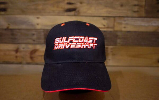 Black Gulf Coast Driveshaft cap with red trim, pre-curved visor, and adjustable Velcro strap. Bold logo in front.