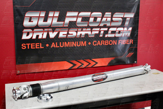 Aluminum slip shaft for Dodge Challenger DEMON 170, featuring polished finish, U-joint assembly, and adapter flange.