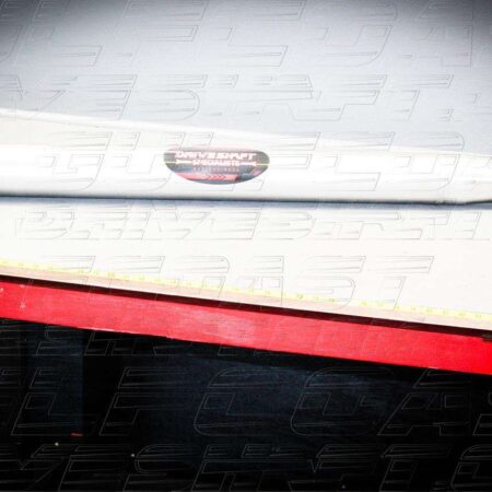 Aluminum 4" driveshaft with a solid cross U-joint, marked with a logo, designed for 2004-2007 Cadillac CTS-V.